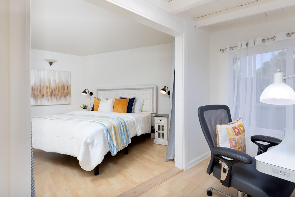 380 Sea Ridge Road, Unit E Aptos, CA 95003 - Photo 20 of 27 a bedroom with bed chair and window