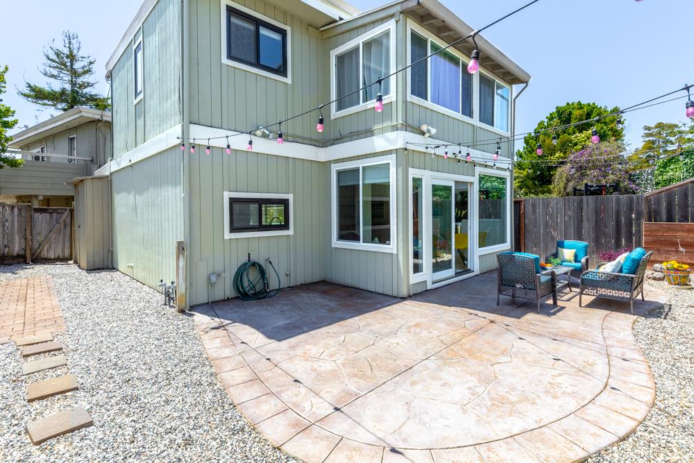 380 Sea Ridge Road, Unit E Aptos, CA 95003 - Photo 2 of 27 a view of a building with a chairs in patio
