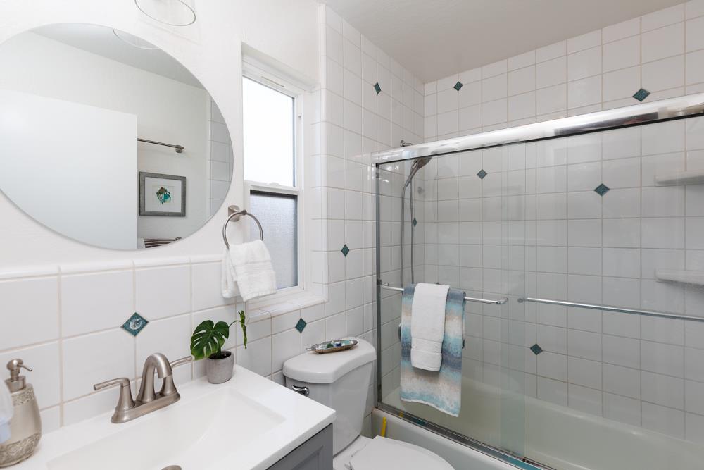 380 Sea Ridge Road, Unit E Aptos, CA 95003 - Photo 23 of 27 a bathroom with a sink toilet and shower