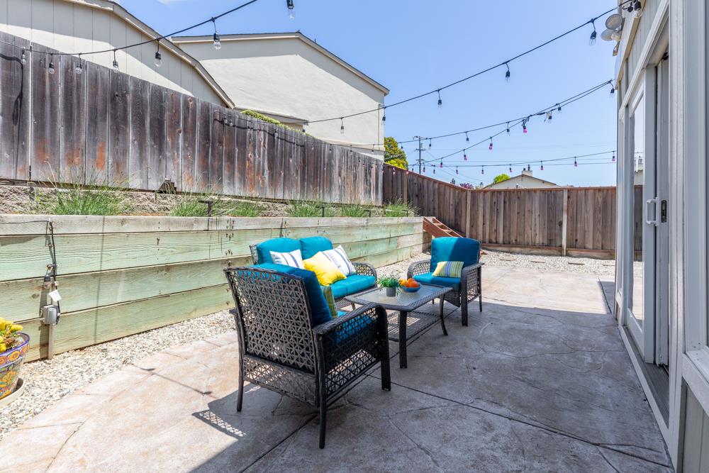 380 Sea Ridge Road, Unit E Aptos, CA 95003 - Photo 8 of 27 a patio with table and chairs