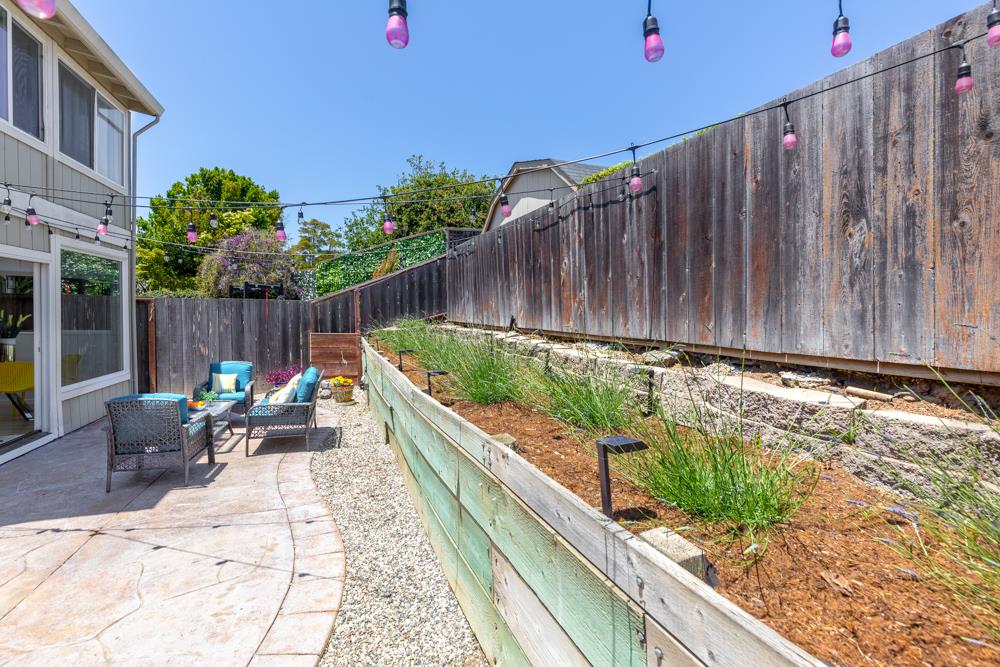 380 Sea Ridge Road, Unit E Aptos, CA 95003 - Photo 9 of 27 a view of two chairs in patio with wooden fence