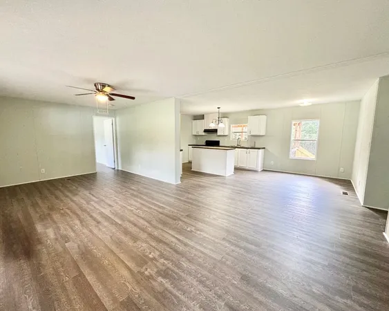 a view of a kitchen with a sink and a stove top oven