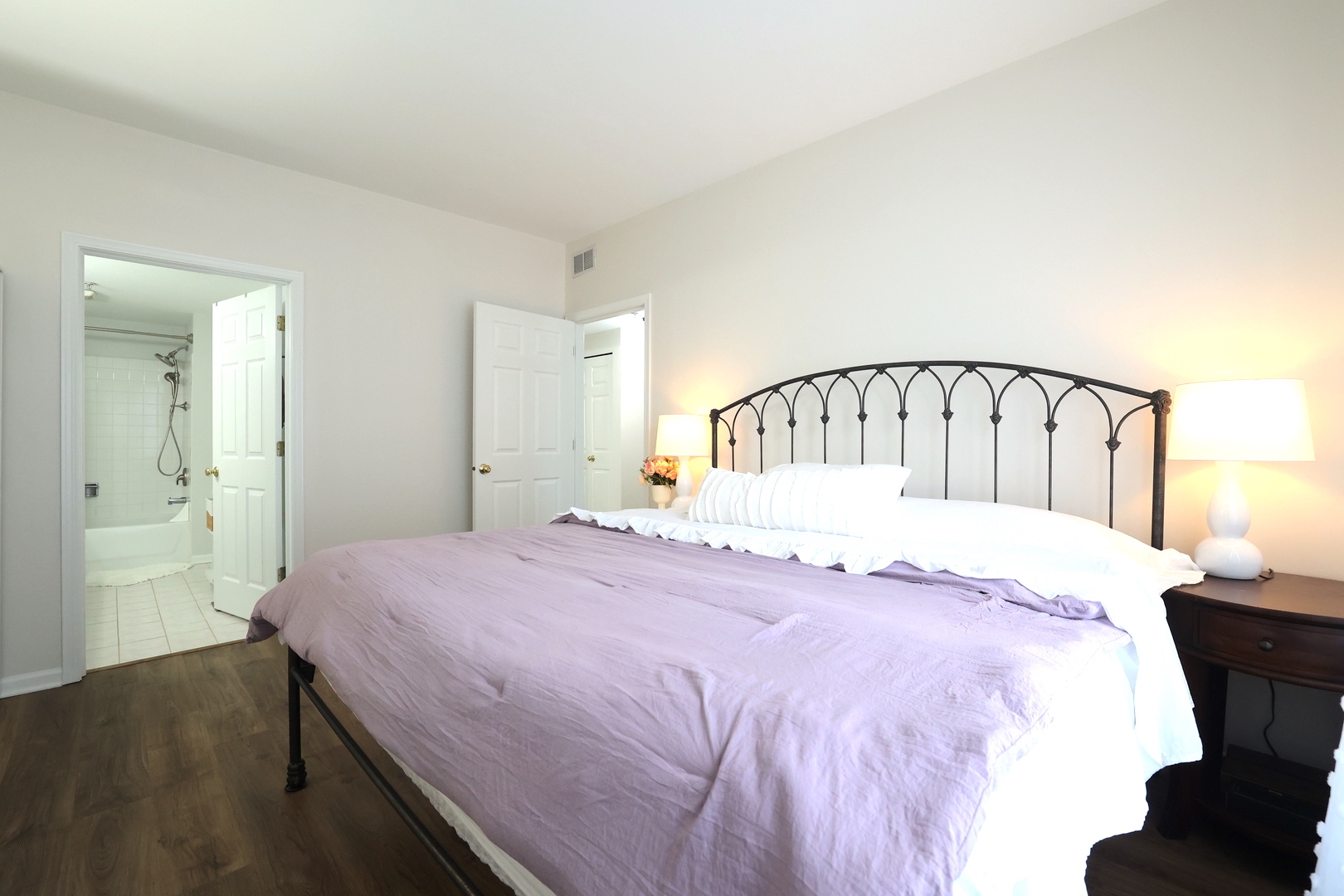 650 Mill Circle, Unit 103 Wheeling, IL 60090 - Photo 11 of 14 a bedroom with a bed and a mirror