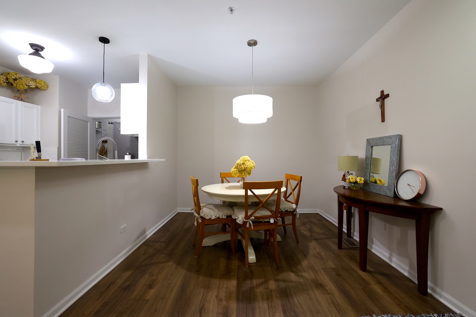 650 Mill Circle, Unit 103 Wheeling, IL 60090 - Photo 2 of 14 a view of a dining room with furniture and wooden floor