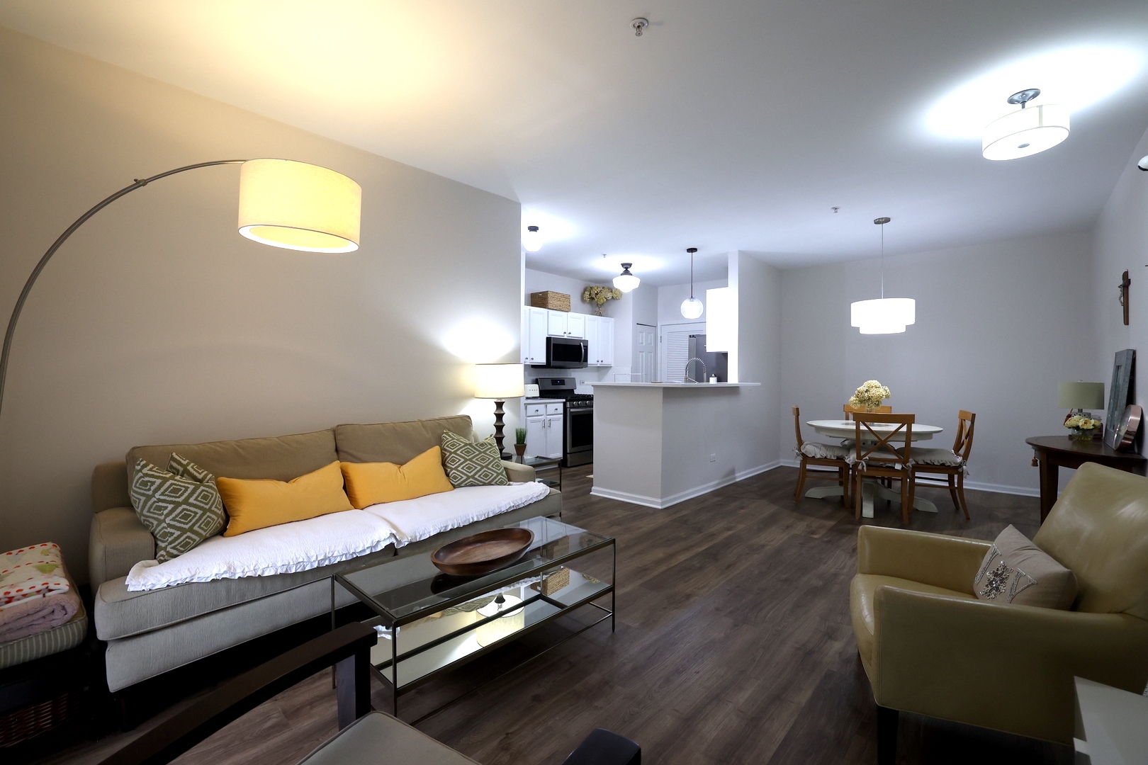 650 Mill Circle, Unit 103 Wheeling, IL 60090 - Photo 10 of 14 a living room with furniture and kitchen view