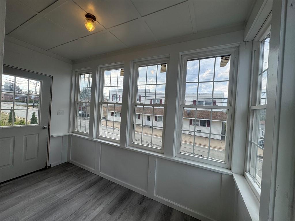 2212 Freeport Road Natrona Heights, PA 15065 - Photo 2 of 26 an empty room with wooden floor and windows