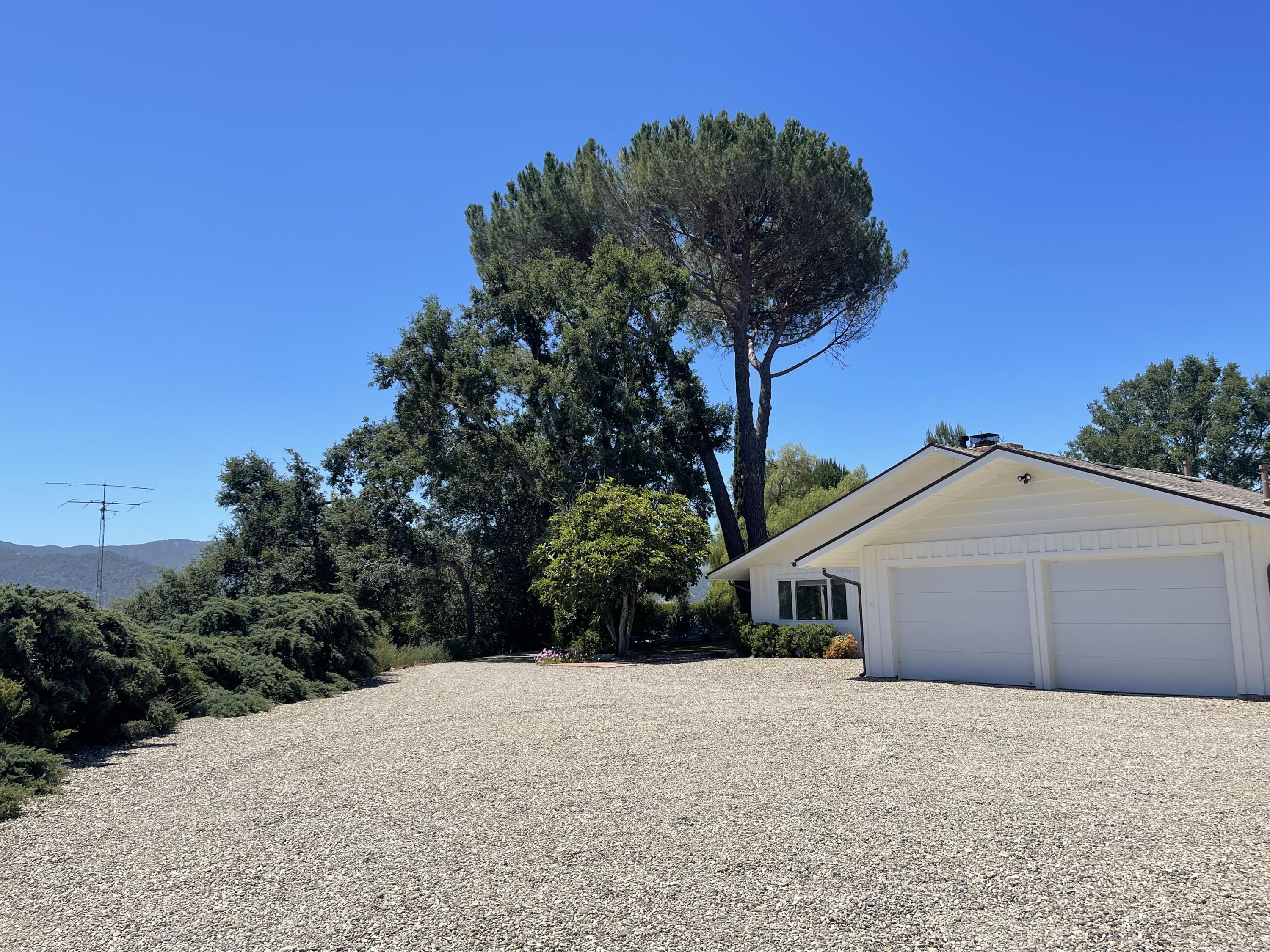 724 North Refugio Road Santa Ynez, CA 93460 - Photo 12 of 17 a front view of a house with a yard and garage