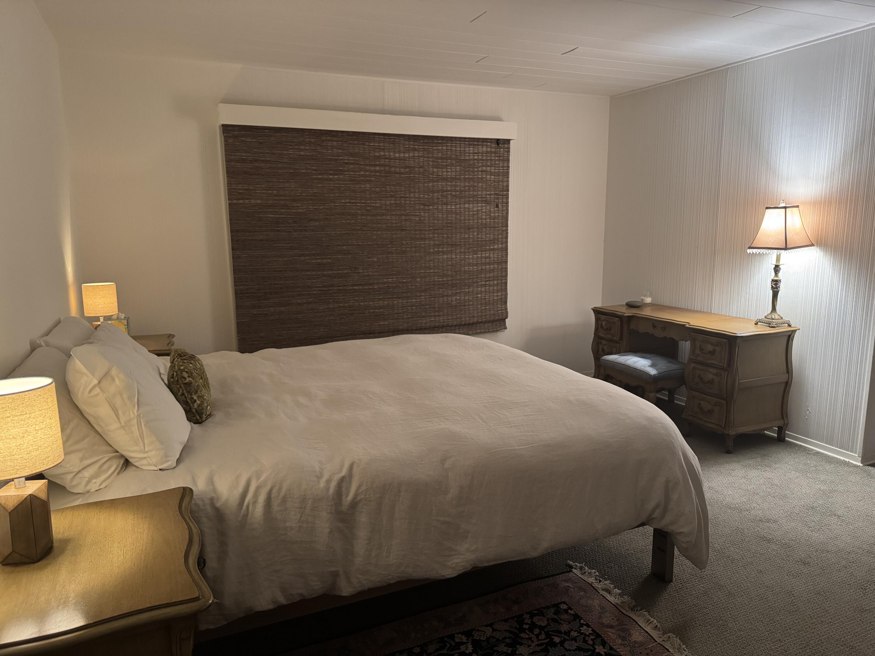 724 North Refugio Road Santa Ynez, CA 93460 - Photo 7 of 17 a bedroom with a bed and lamps