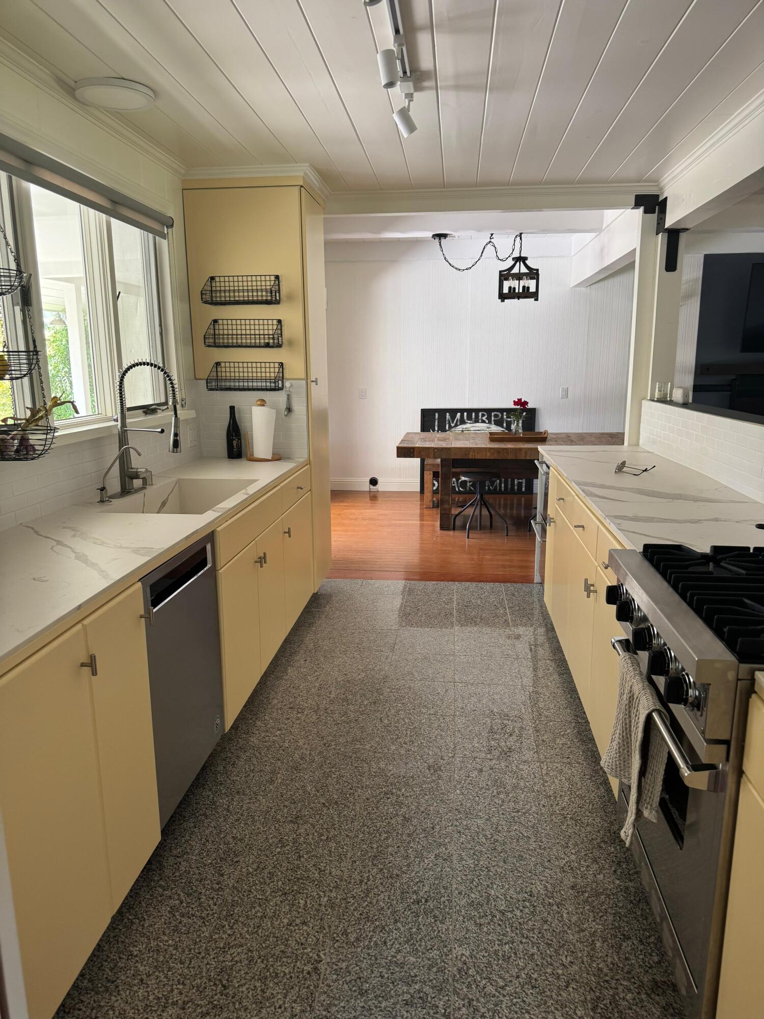 724 North Refugio Road Santa Ynez, CA 93460 - Photo 9 of 17 a kitchen with stainless steel appliances a sink dishwasher stove and white cabinets