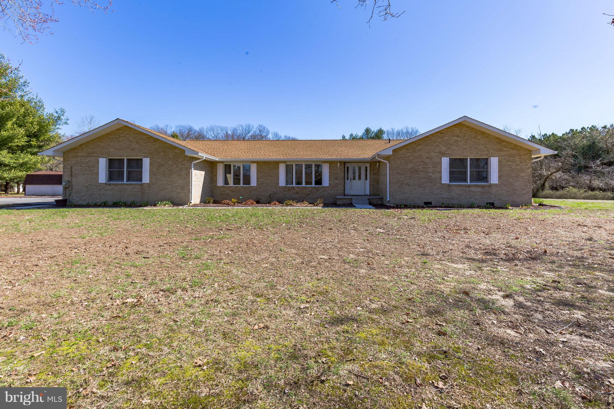 3142 Soper Road Huntingtown, MD 20639 - Photo 1 of 30 a house that has a tree in front of it