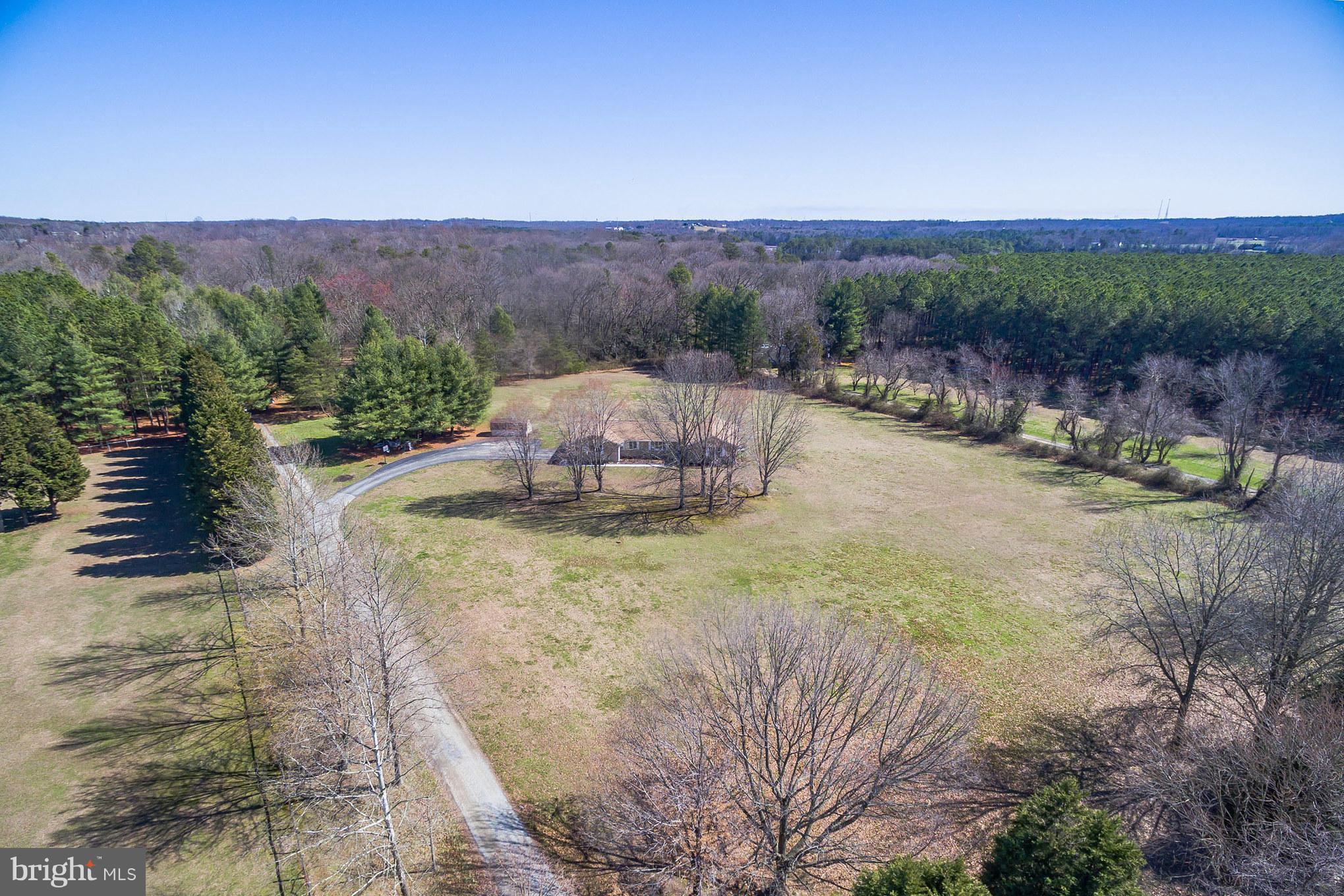 3142 Soper Road Huntingtown, MD 20639 - Photo 2 of 30 a view of a yard with an outdoor space