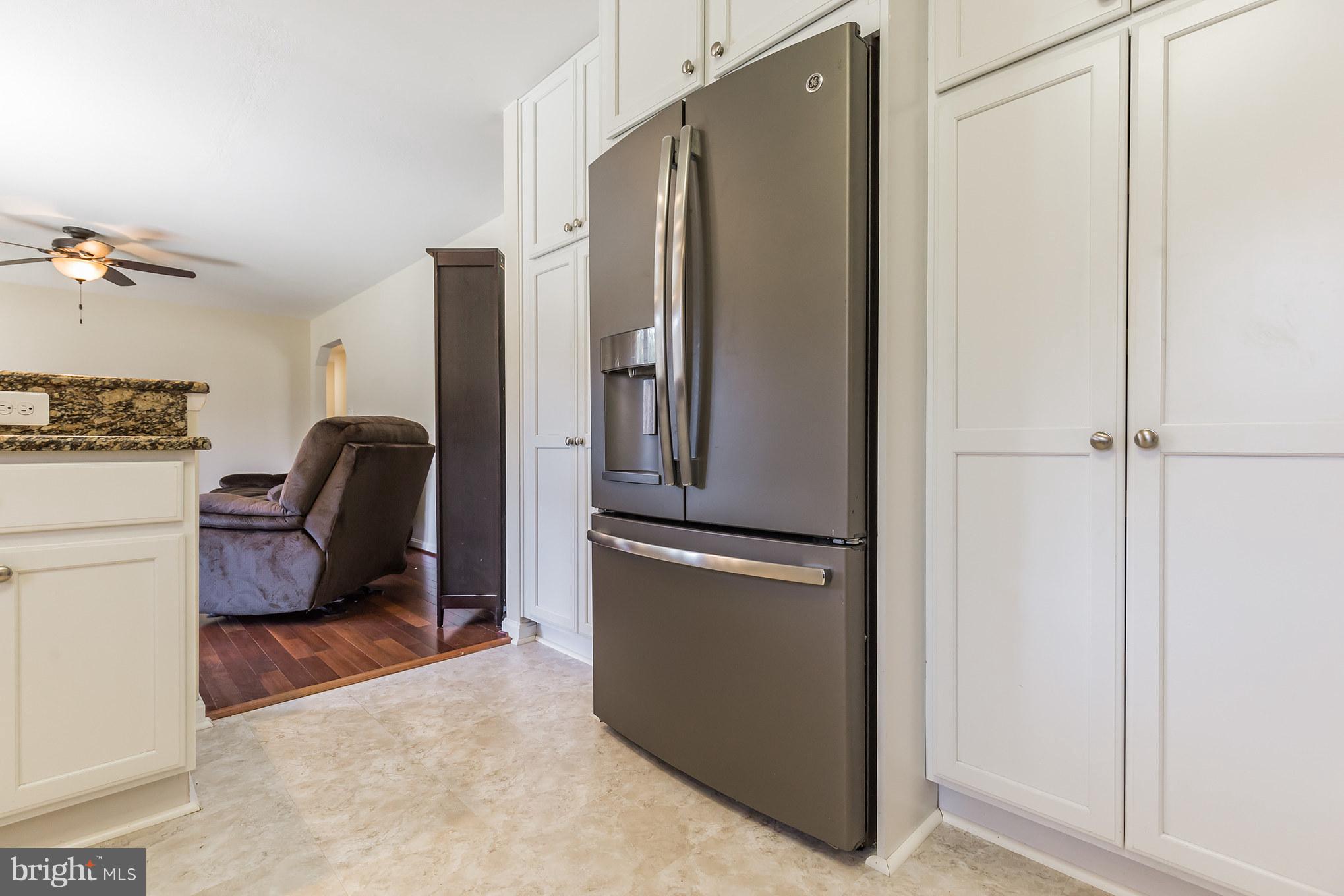 3142 Soper Road Huntingtown, MD 20639 - Photo 21 of 30 a kitchen with stainless steel appliances granite countertop a refrigerator and a stove