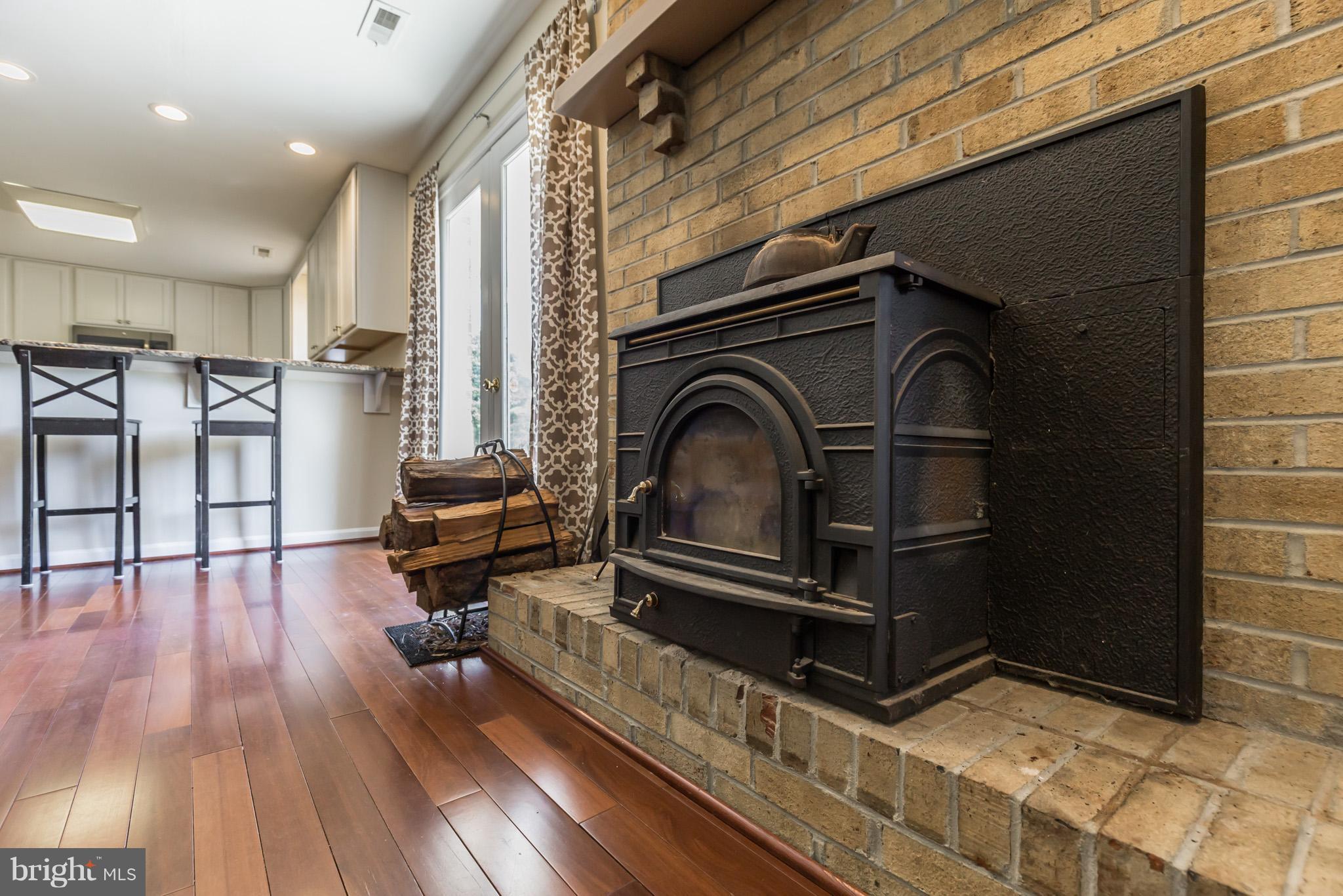 3142 Soper Road Huntingtown, MD 20639 - Photo 25 of 30 a living room with furniture oven and wooden floor