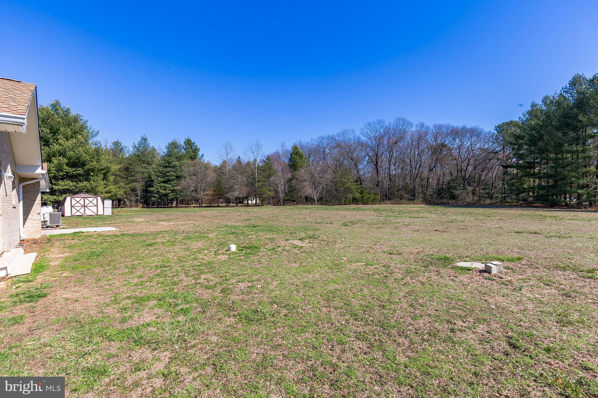 3142 Soper Road Huntingtown, MD 20639 - Photo 30 of 30 a view of a field with trees in the background