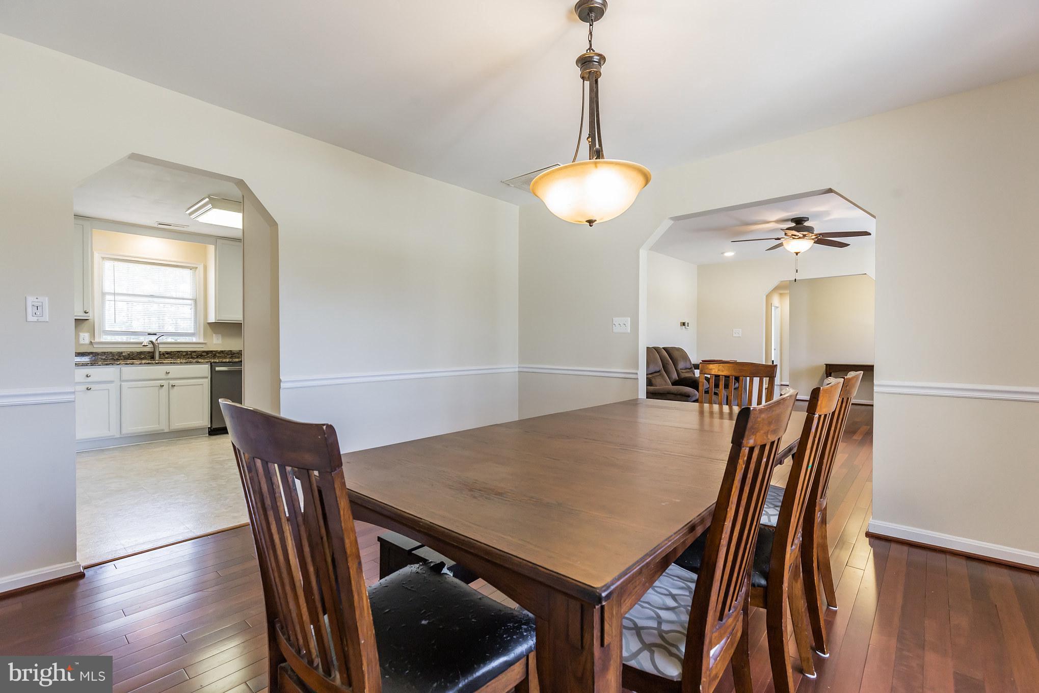 3142 Soper Road Huntingtown, MD 20639 - Photo 6 of 30 a view of a dining room with furniture