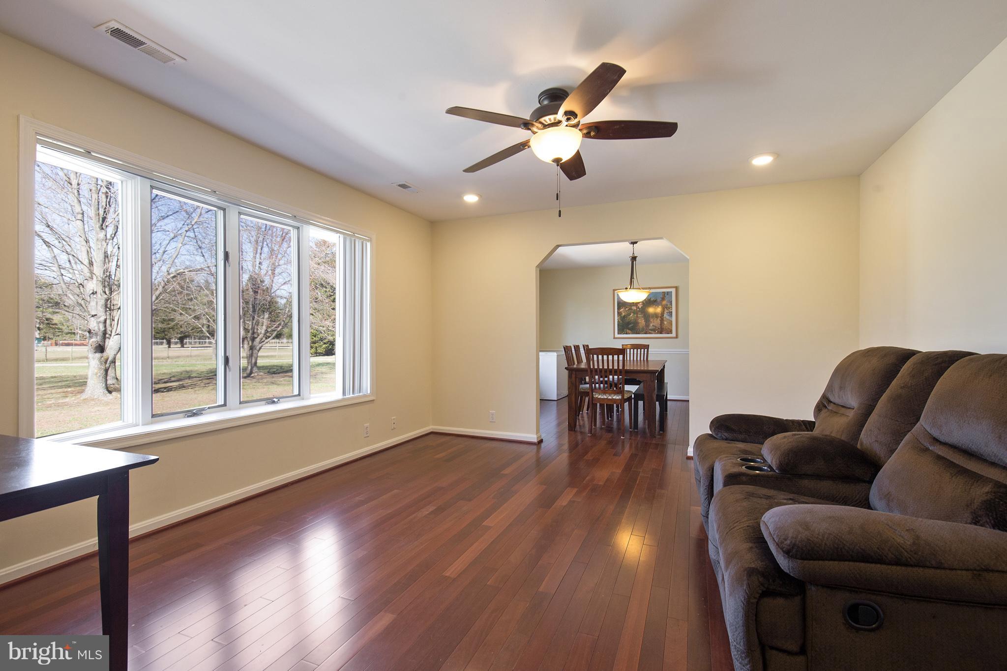 3142 Soper Road Huntingtown, MD 20639 - Photo 7 of 30 a living room with furniture and a wooden floor