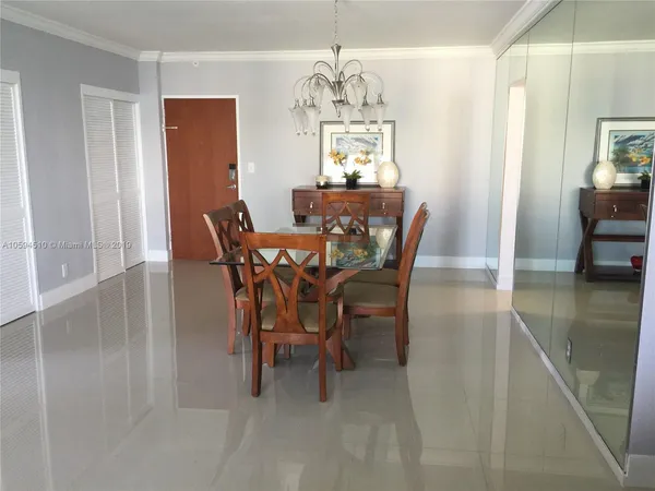 a view of a dining room with furniture and window