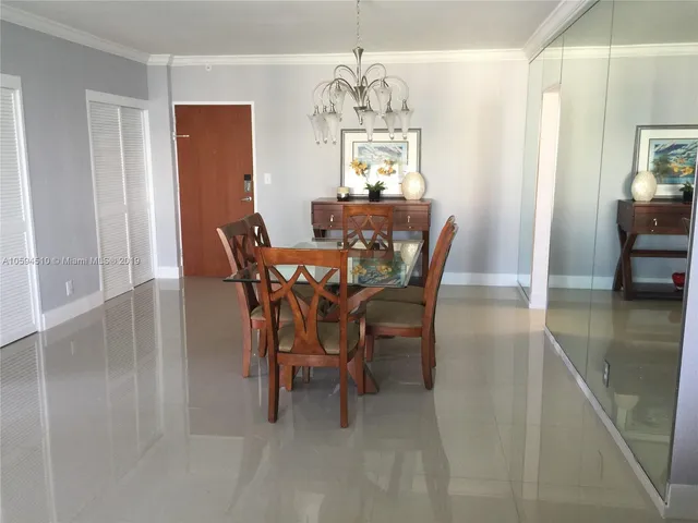 a view of a dining room with furniture and window