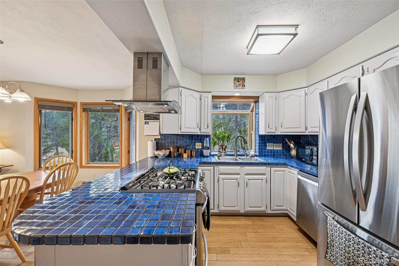 206 Pinon Circle Black Hawk, CO 80422 - Photo 12 of 50 a kitchen with stainless steel appliances granite countertop a refrigerator stove top oven and sink