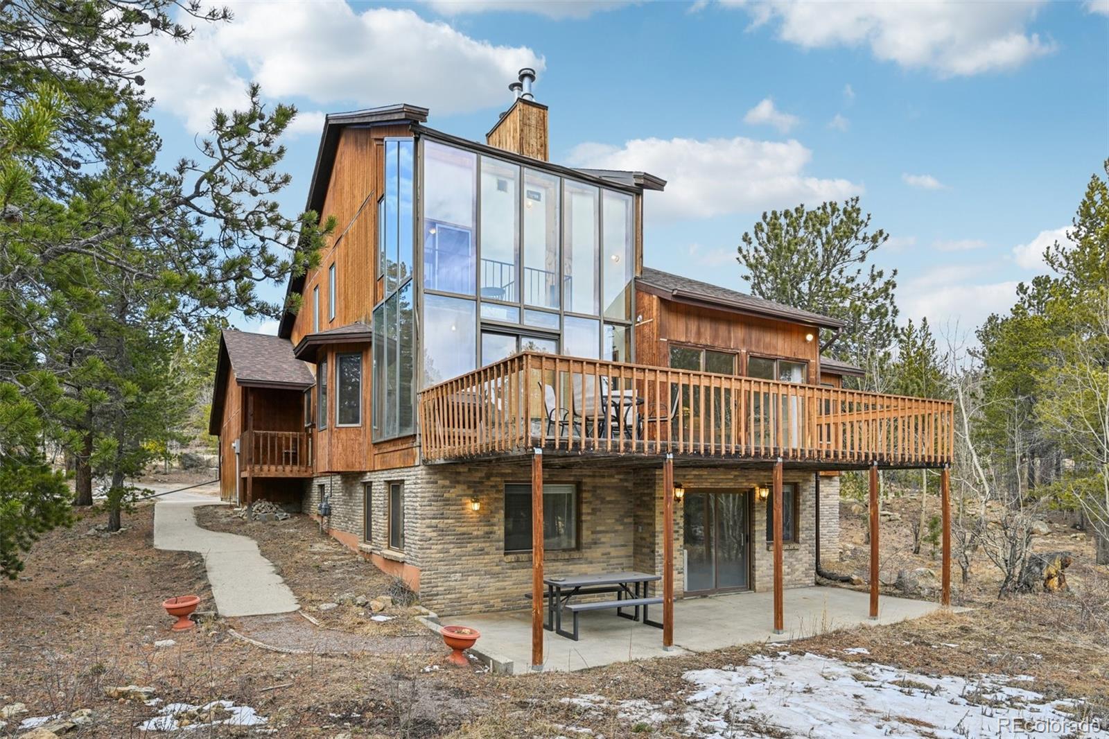 206 Pinon Circle Black Hawk, CO 80422 - Photo 3 of 50 a view of a house with a yard