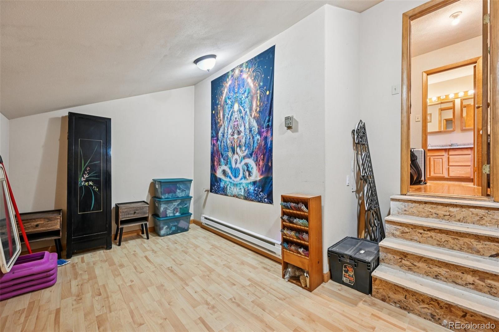 206 Pinon Circle Black Hawk, CO 80422 - Photo 33 of 50 a bedroom with furniture and a window