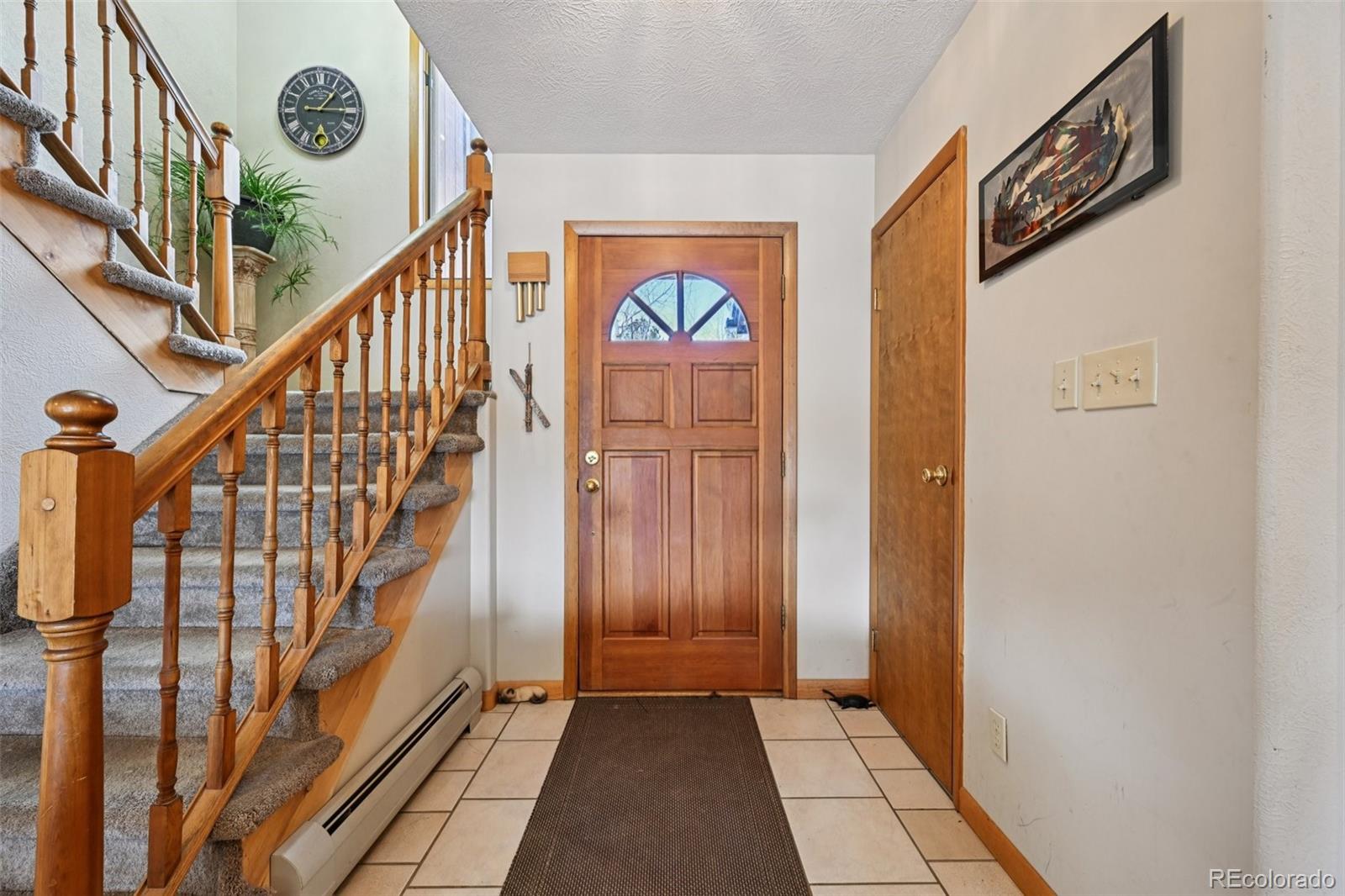 206 Pinon Circle Black Hawk, CO 80422 - Photo 7 of 50 a view of an entryway with wooden floor