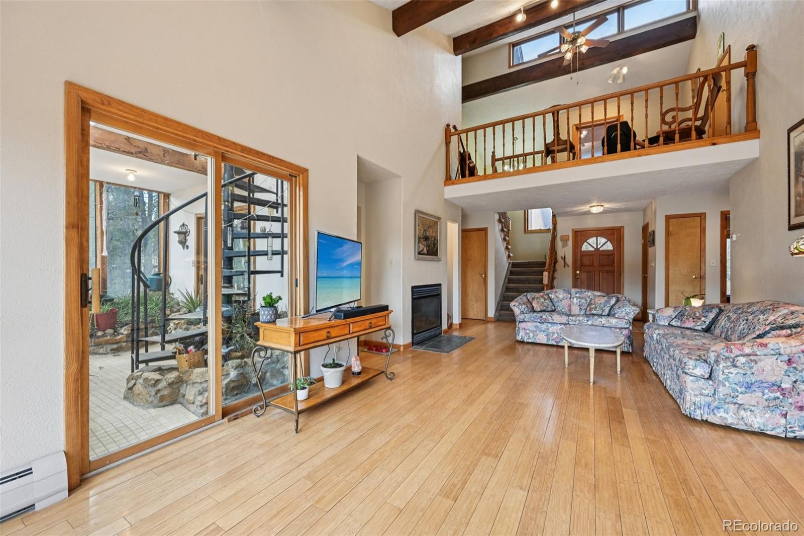 206 Pinon Circle Black Hawk, CO 80422 - Photo 9 of 50 a living room with furniture a rug and a large window