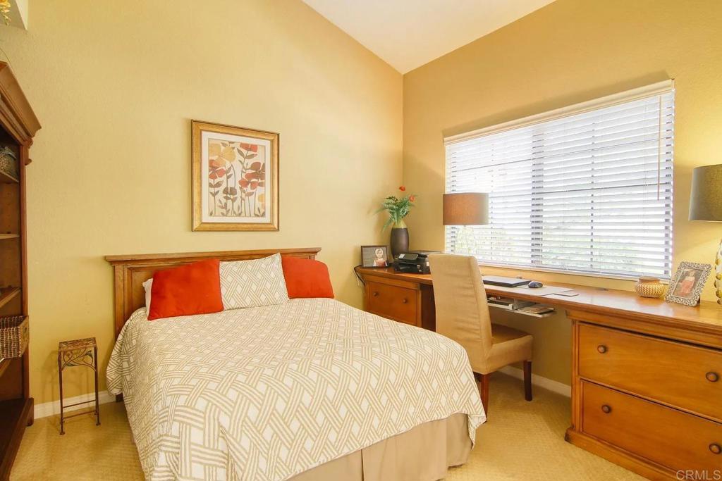 7302 Paseo Verde Carlsbad, CA 92009 - Photo 11 of 24 a bed room with a bed and a chair