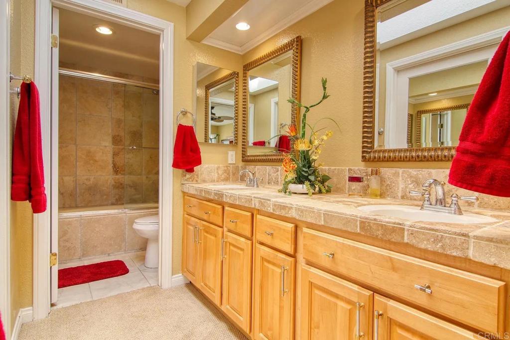 7302 Paseo Verde Carlsbad, CA 92009 - Photo 12 of 24 a bathroom with a bathtub sink and mirror