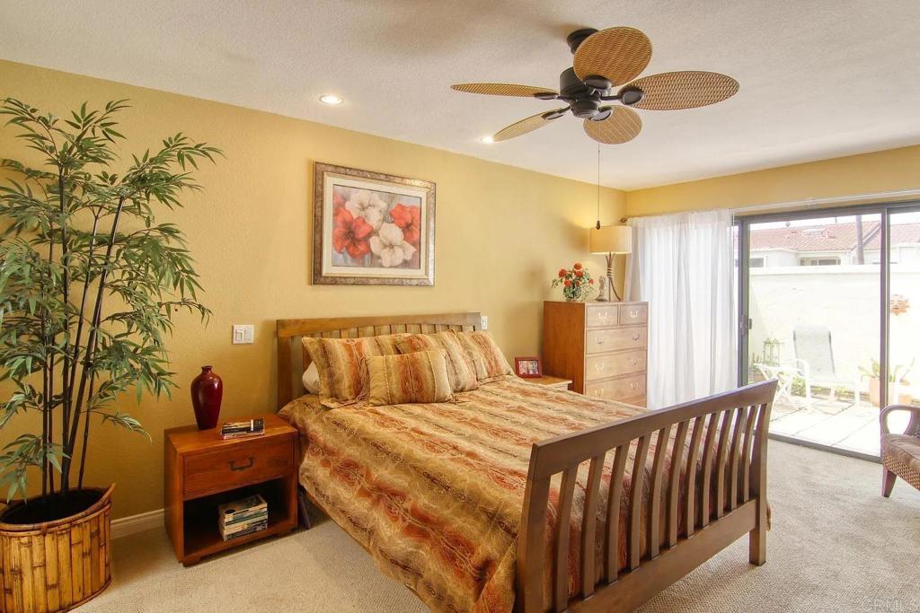 7302 Paseo Verde Carlsbad, CA 92009 - Photo 13 of 24 a bed room with a bed and a chandelier