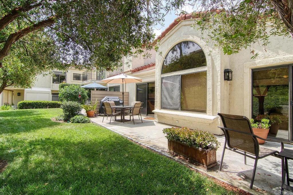 7302 Paseo Verde Carlsbad, CA 92009 - Photo 18 of 24 a front view of house with yard and outdoor seating