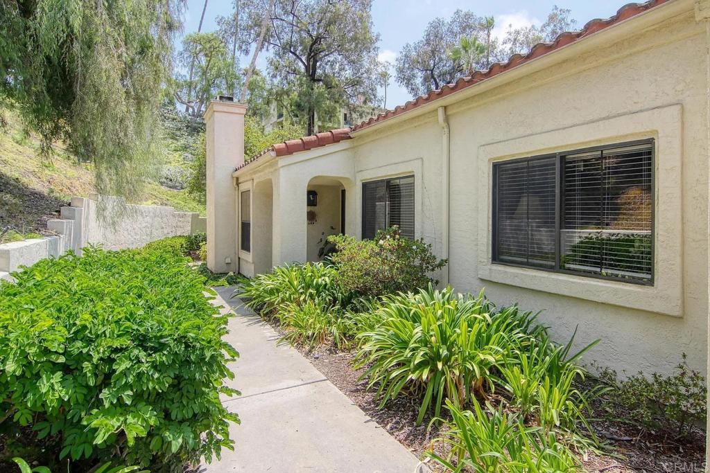 7302 Paseo Verde Carlsbad, CA 92009 - Photo 19 of 24 a front view of a house with garden