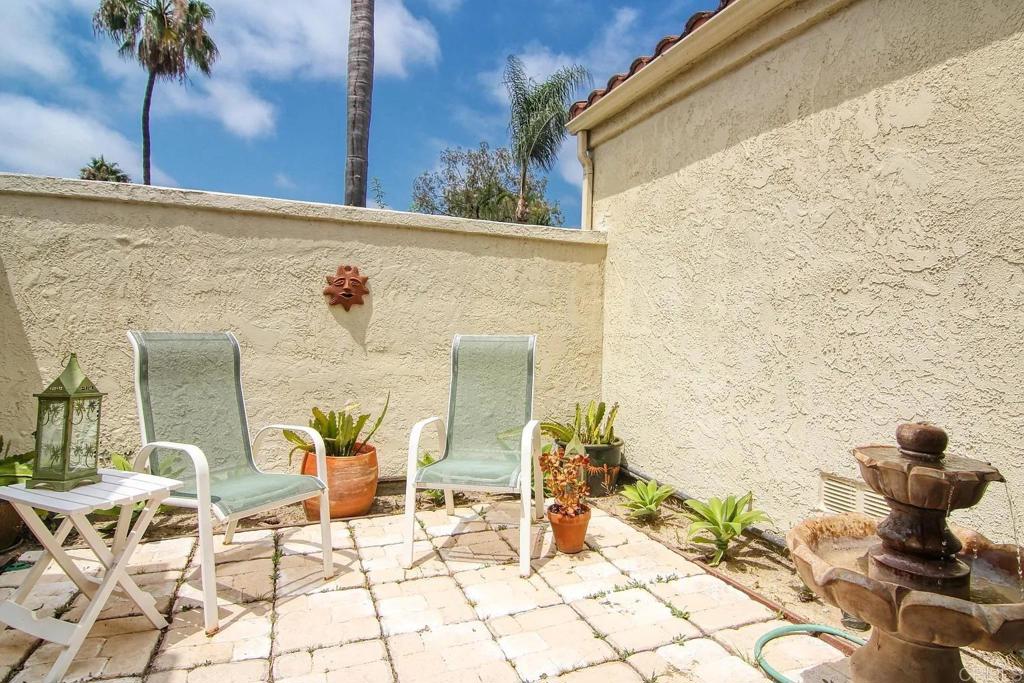 7302 Paseo Verde Carlsbad, CA 92009 - Photo 21 of 24 a view of balcony with two chairs and potted plants