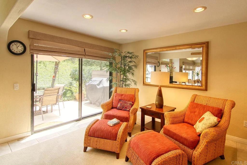7302 Paseo Verde Carlsbad, CA 92009 - Photo 6 of 24 a living room with furniture and a large window