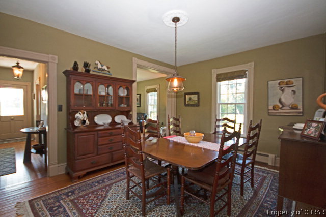 3918 East River Road Cardinal, VA 23025 - Photo 11 of 37 a view of a dining room with furniture window and wooden floor