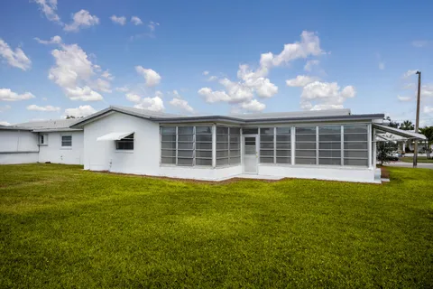 a view of a swimming pool and an outdoor space