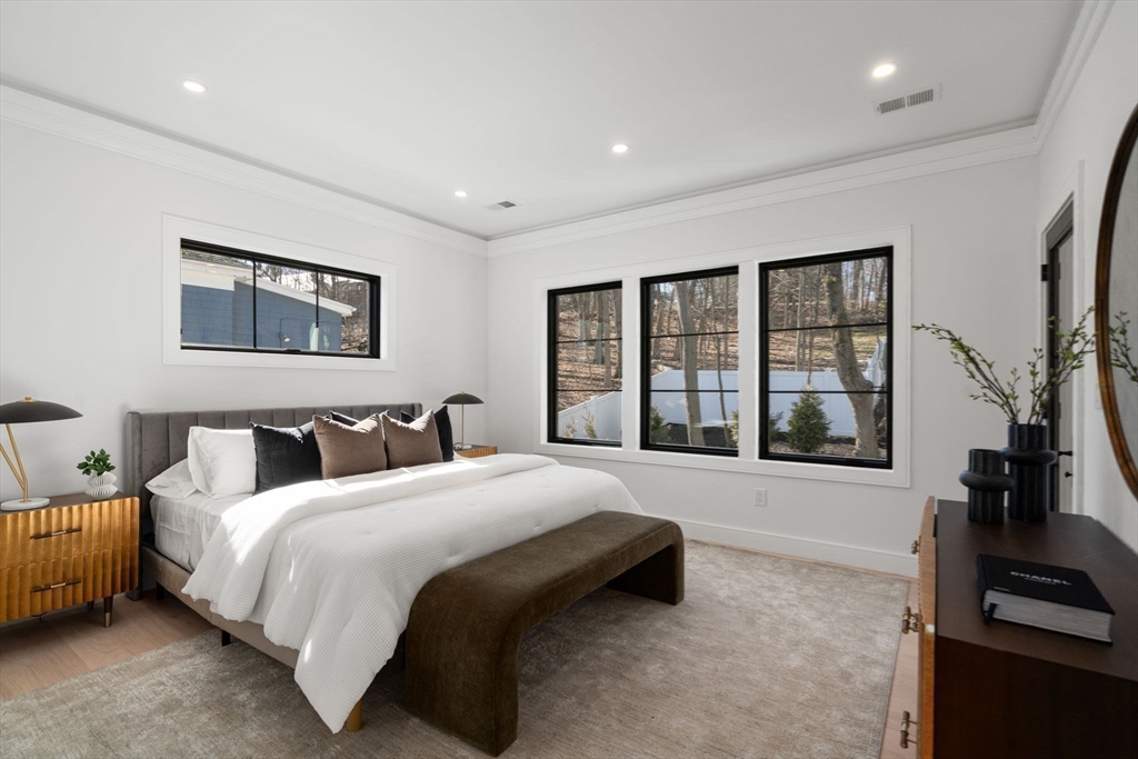49 Ripley Street Newton, MA 02459 - Photo 11 of 32 a spacious bedroom with a large bed and a large window