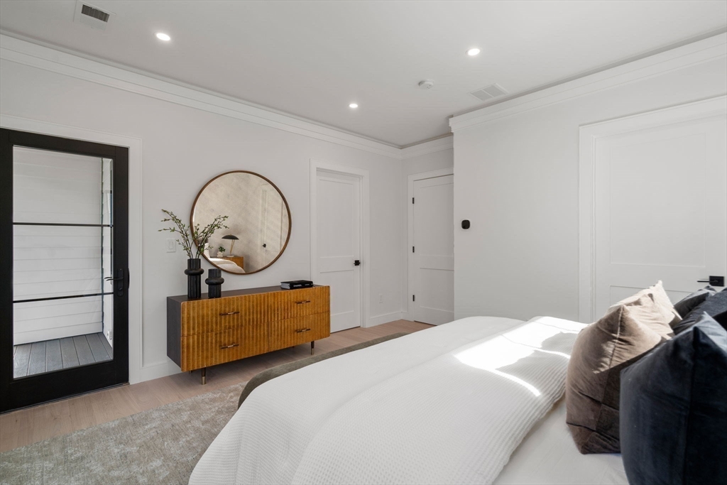 49 Ripley Street Newton, MA 02459 - Photo 12 of 32 a bedroom with bed and a window