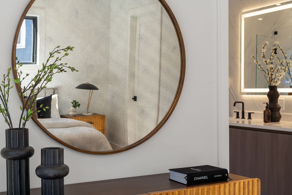 49 Ripley Street Newton, MA 02459 - Photo 13 of 32 a view of a livingroom with furniture and staircase