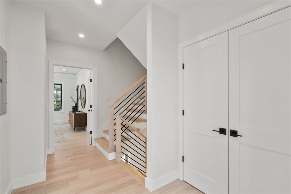 49 Ripley Street Newton, MA 02459 - Photo 17 of 32 a view of a hallway with wooden floor and entryway