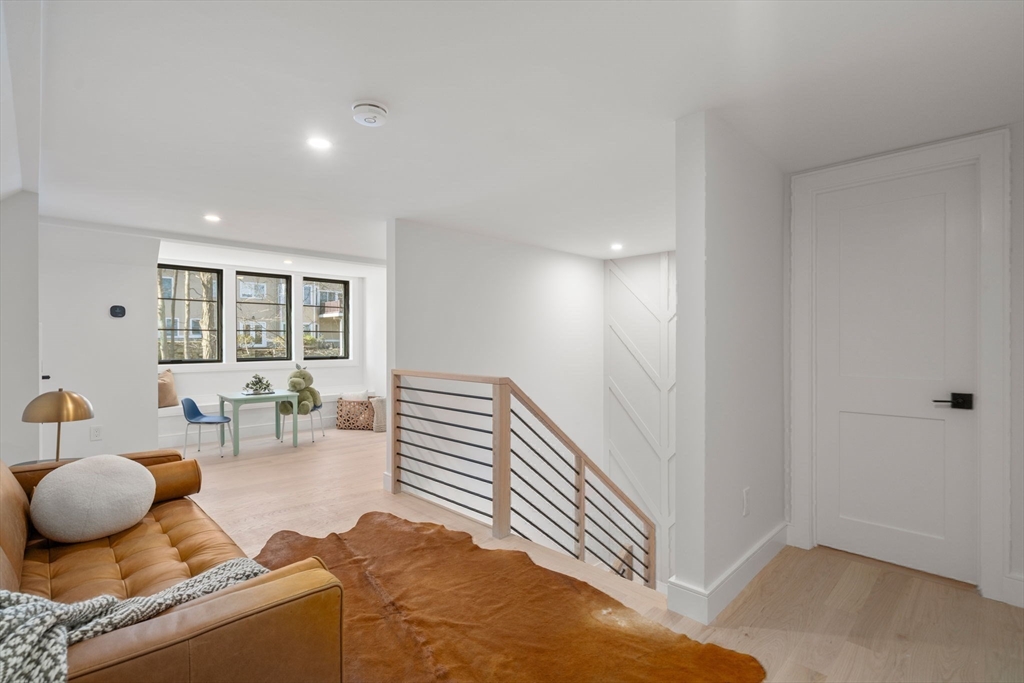49 Ripley Street Newton, MA 02459 - Photo 21 of 32 a living room with furniture and wooden floor