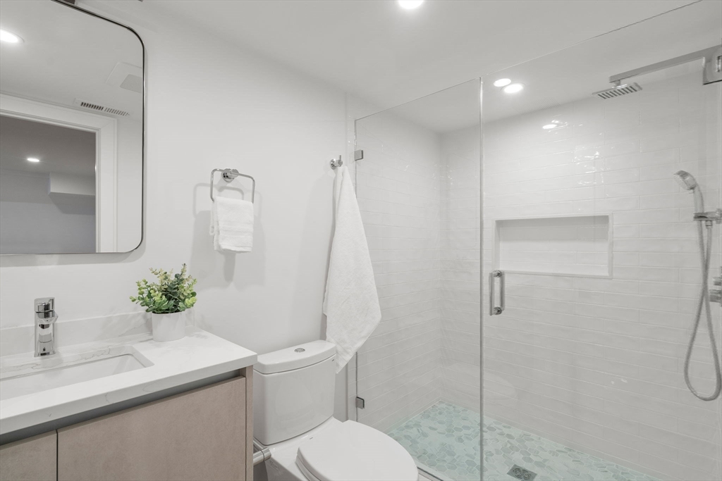 49 Ripley Street Newton, MA 02459 - Photo 22 of 32 a bathroom with a sink toilet and shower