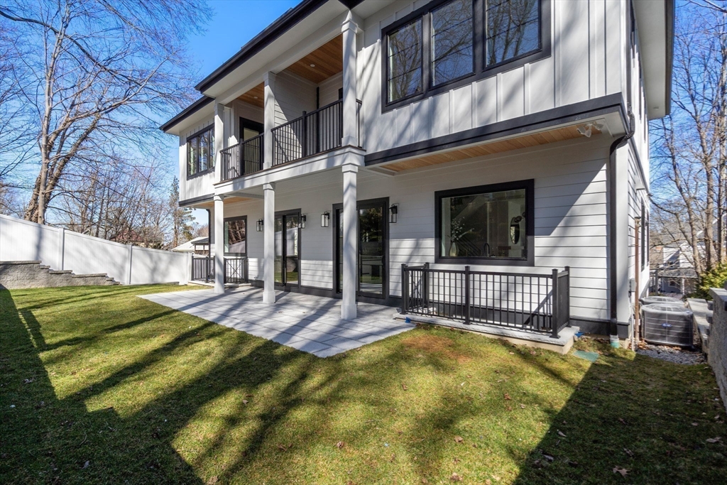 49 Ripley Street Newton, MA 02459 - Photo 28 of 32 a view of a house with a yard patio and fire pit