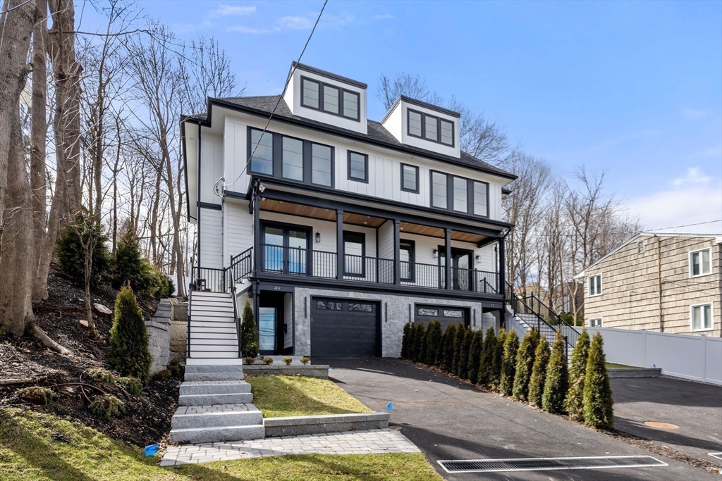 49 Ripley Street Newton, MA 02459 - Photo 29 of 32 a front view of a house with a yard