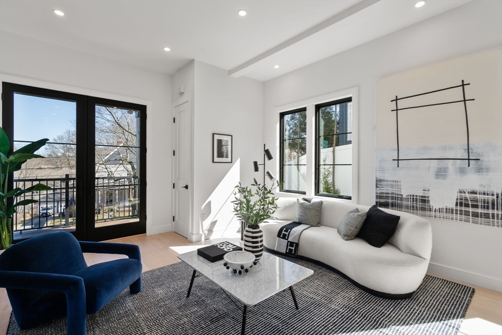 49 Ripley Street Newton, MA 02459 - Photo 3 of 32 a living room with furniture and a large window