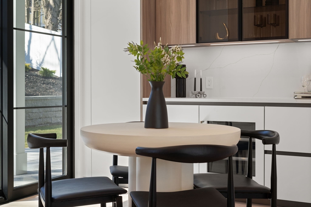 49 Ripley Street Newton, MA 02459 - Photo 9 of 32 a view of a dining room with furniture and window