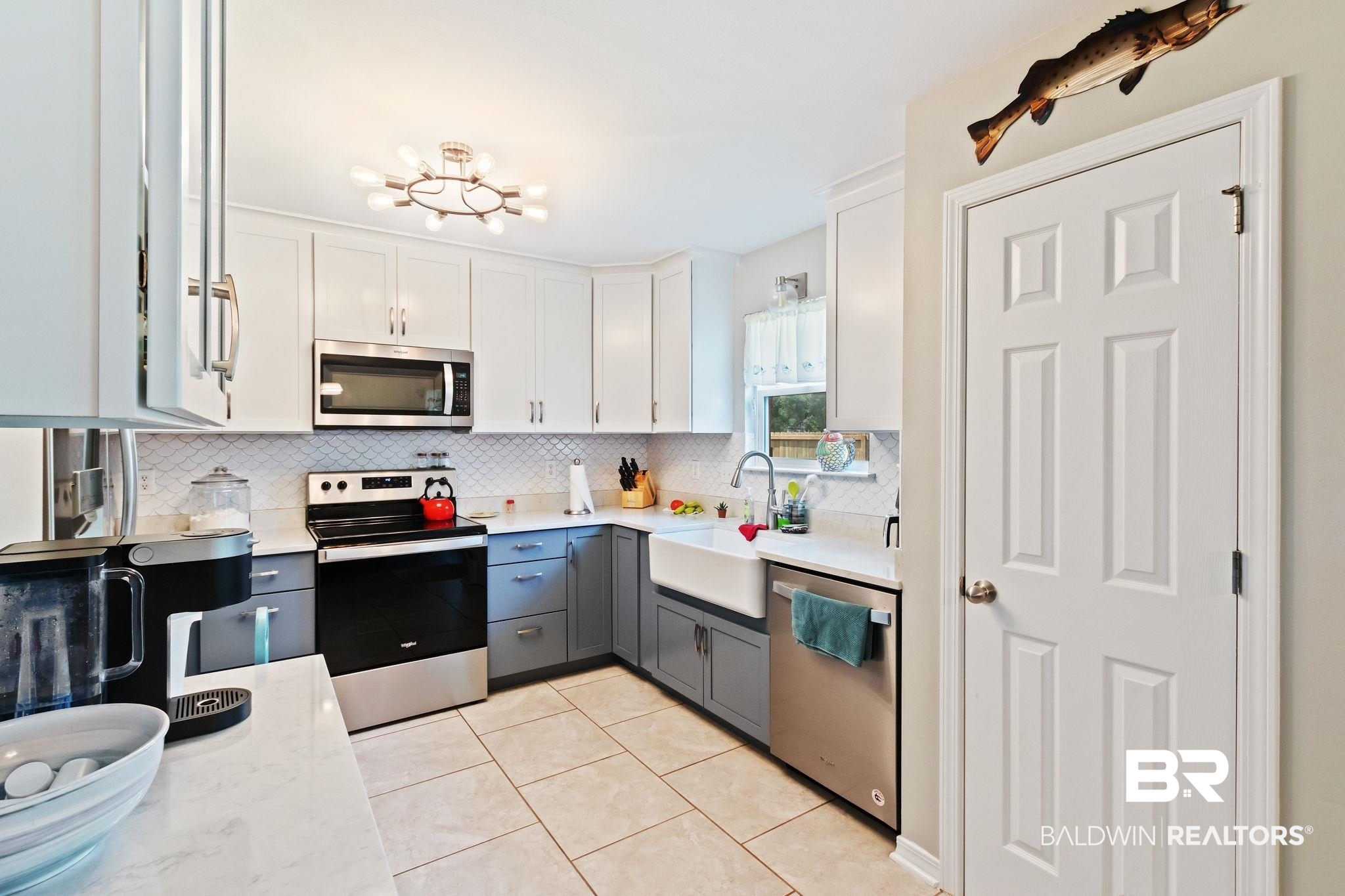 16898 Sugar Loop Foley, AL 36535 - Photo 20 of 67 Kitchen with white cabinets, stainless steel appliances, decorative backsplash, and sink