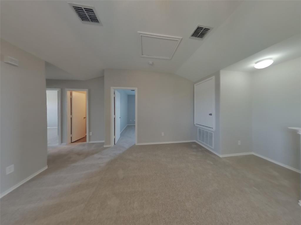216 Rambling Way Forney, TX 75126 - Photo 18 of 22 a view of an empty room with closet and a chandelier fan