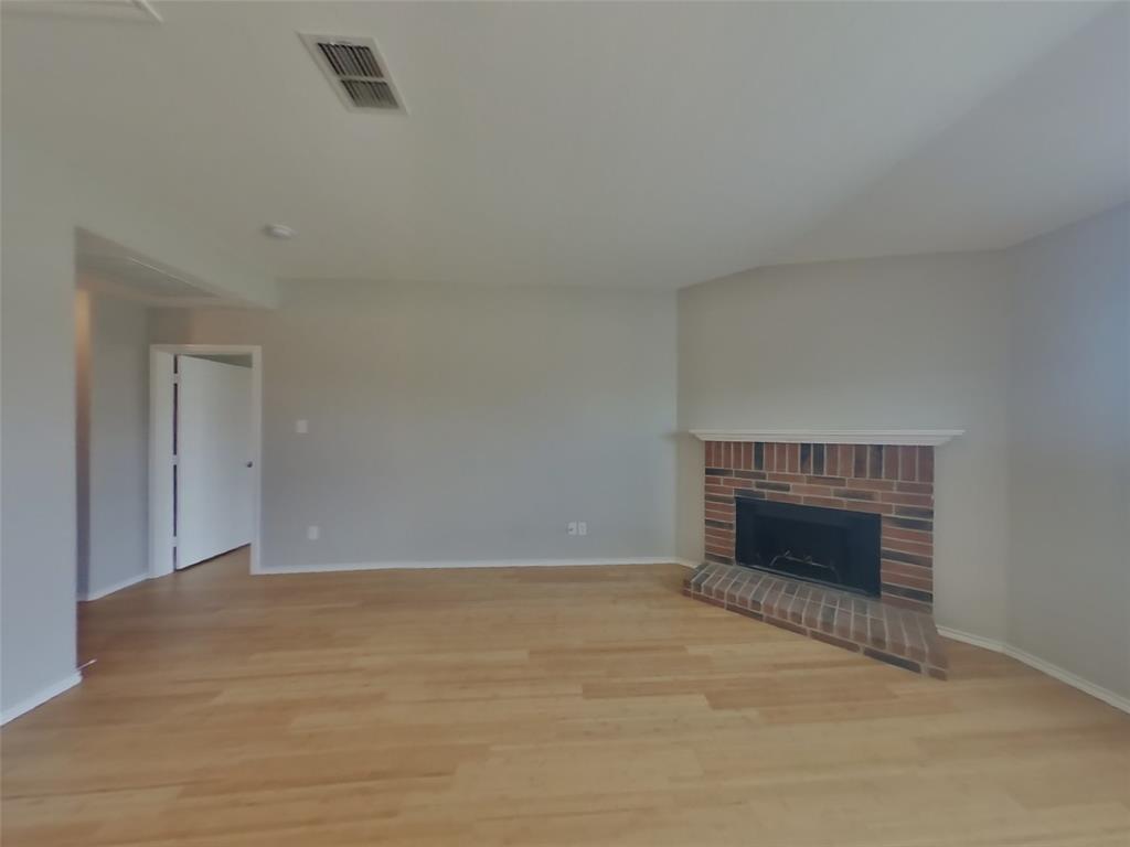216 Rambling Way Forney, TX 75126 - Photo 3 of 22 a view of empty room with a fireplace