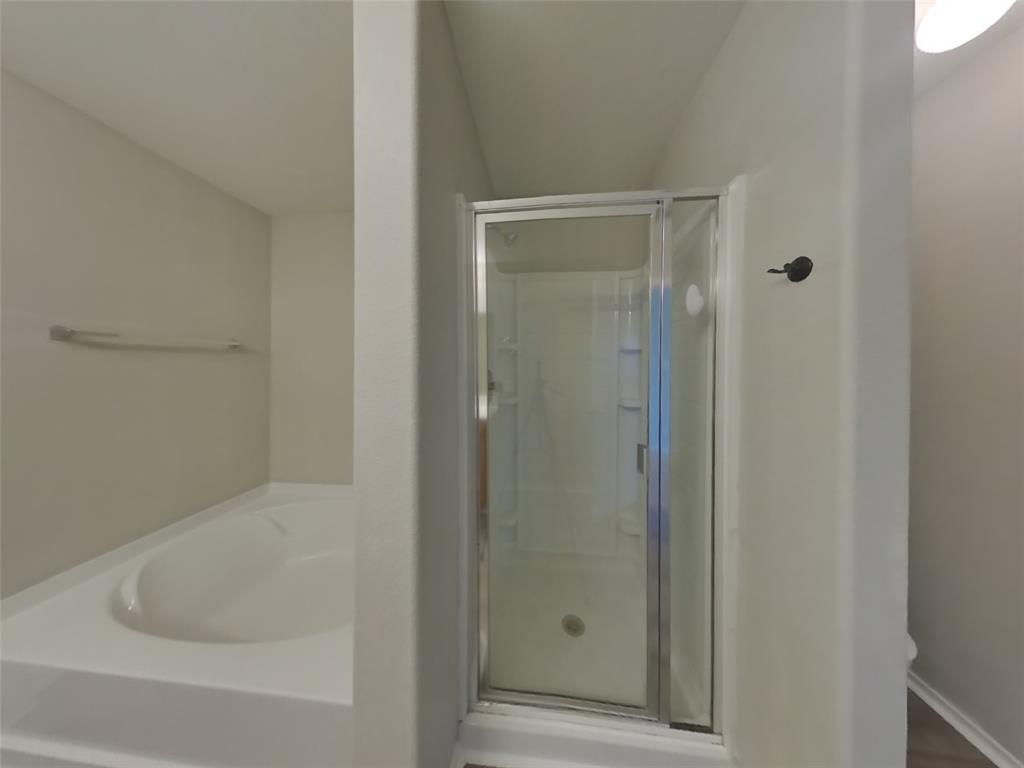 216 Rambling Way Forney, TX 75126 - Photo 9 of 22 a bathroom with a bathtub